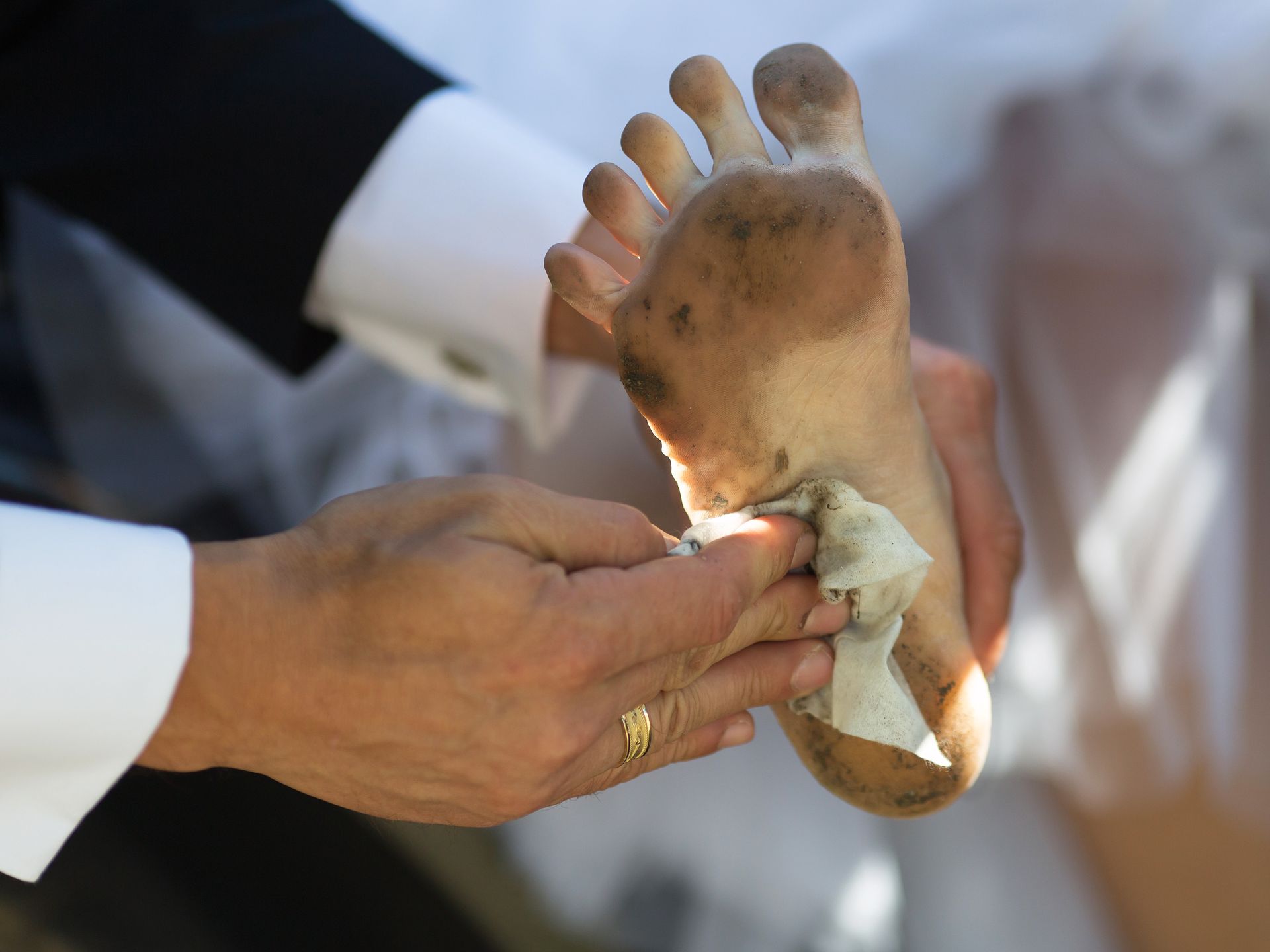 Funny dirty foot. Hand of groom with cloth, who wipes dirty foot of his brideZabusik Aleksey sabus_a@rambler.Barefoot, Black, Bride, Brown, Celebration, Cloth, Couple, Dirt, Dirty, Female, Fingers, Foot, Fun, Funny, Girl, Groom, Grunge, Hand, Healthy Lifestyle, Heel, Heterosexual, Human, Human Foot, Husband, Love, Male, Man, Married, Mud, Muddy, Napkin, Nature, Newlywed, Open Air, Outdoors, People, Suit, Summer, Toes, Togetherness, Two, Wash, Wedding, White, Wife, Wipe, Woman, Young, Yuck, foot, hand, barefoot, napkin, mud, dirt, dirty, fingers, bride, female, married, newlywed, outdoors, black, brown, celebration, cloth, couple, fun, funny, girl, groom, grunge, healthy lifestyle, heel, heterosexual, human, human foot, husband, love, male, man, muddy, nature, open air, people, suit, summer, toes, togetherness, two, wash, wedding, white, wife, wipe, woman, young, yuck