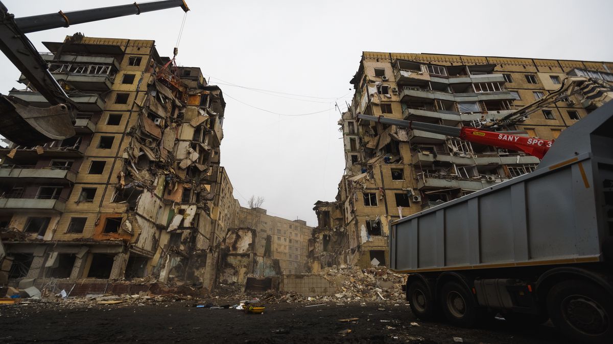 DNIPRO, UKRAINE - JANUARY 16: A high-rise residential building lies partially destroyed after a missile strike on January 16, 2023 in Dnipro, Ukraine. On January 14, Russia launched a new massive attack on Ukrainian cities. In Dnipro, one of the Х-22 cruise missiles hit a nine-story residential building, completely destroying one of the sections from top to bottom floors. The number of dead has increased to 40 people, with rescue work continuing. More than 25 residents of the building are still being searched. (Photo by Yurii Stefanyak/Global Images Ukraine via Getty Images)