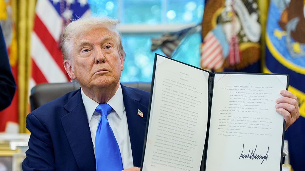 Trump To Add $100,000 Fee For H-1B Visas In Latest Crackdown
US President Donald Trump holds a signed executive order authorizing the Trump Gold Card in the Oval Office of the White House in Washington, DC, US, on Friday, Sept. 19, 2025. Trump is signing a proclamation that would move to extensively overhaul the H-1B visa program, requiring a $100,000 fee for applications in a bid to curb overuse, according to a White House official familiar with the matter. Photographer: Aaron Schwartz/CNP/Bloomberg via Getty Images
Bloomberg
2025uspolitics, north american, u.s. government, us, united states of america, americas, government news, u.s.a., american