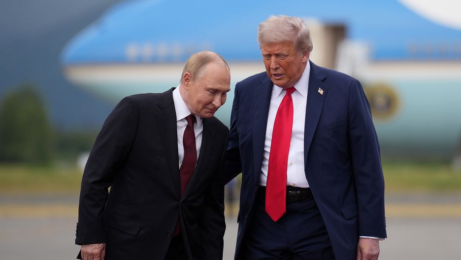 ANCHORAGE, ALASKA - AUGUST 15: U.S. President Donald Trump (R) greets Russian President Vladimir Putin (L) as he arrives at Joint Base Elmendorf-Richardson on August 15, 2025 in Anchorage, Alaska. The two leaders are meeting for peace talks aimed at ending the war in Ukraine.  (Photo by Andrew Harnik/Getty Images)