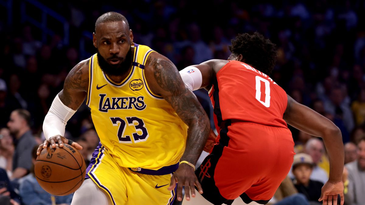 LOS ANGELES, CALIFORNIA - APRIL 11: LeBron James #23 of the Los Angeles Lakers drives past Aaron Holiday #0 of the Houston Rockets during the second quarter at Crypto.com Arena on April 11, 2025 in Los Angeles, California. NOTE TO USER: User expressly acknowledges and agrees that, by downloading and or using this photograph, User is consenting to the terms and conditions of the Getty Images License Agreement. (Photo by Katelyn Mulcahy/Getty Images)