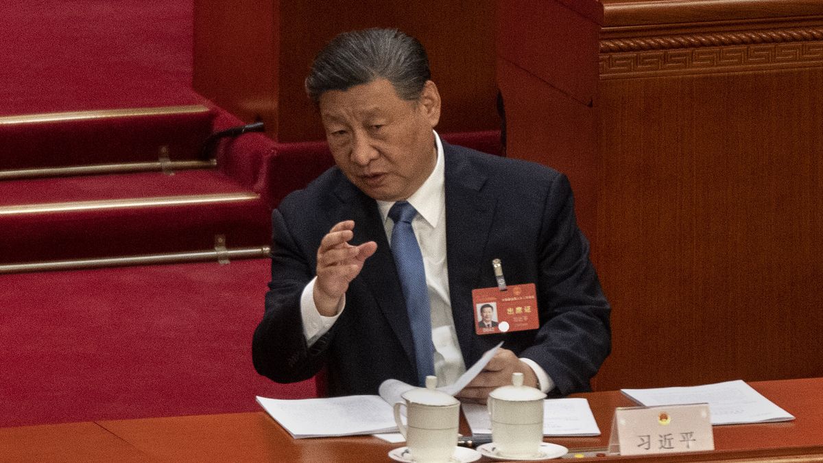 BEIJING, CHINA - MARCH 8: Chinese President Xi Jinping speaks to NPC Chairman Zhao Leji, not seen, at the second plenary session of the National Peoples Congress at the Great Hall of the People on March 8, 2024 in Beijing, China. China's annual political gathering known as the Two Sessions convenes leaders and lawmakers to set the government's agenda for domestic economic and social development for the year. (Photo by Kevin Frayer/Getty Images)