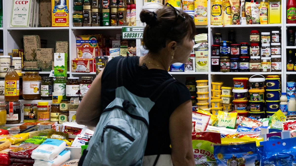 A customer at a grocery store in the Naran Tuul market in Ulaanbaatar, Mongolia, on Sunday, Sept. 3, 2023. Mongolia's real GDP grew 6.4% y/y to 13.6 trillion tugrik ($3.94 billion) in the first half of 2023, according to preliminary results in a report from the National Statistics Office. Photographer: SeongJoon Cho/Bloomberg via Getty Images
