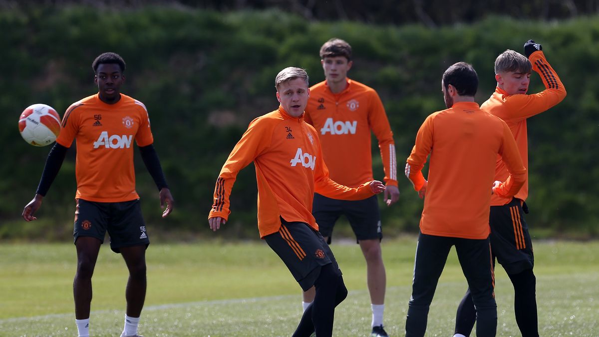 MANCHESTER, ENGLAND - APRIL 13: (EXCLUSIVE COVERAGE) Anthony Elanga, Donny van de Beek, Will Fish of Manchester United in action during a first team training session at Aon Training Complex on April 13, 2021 in Manchester, England. (Photo by Matthew Peters/Manchester United via Getty Images)