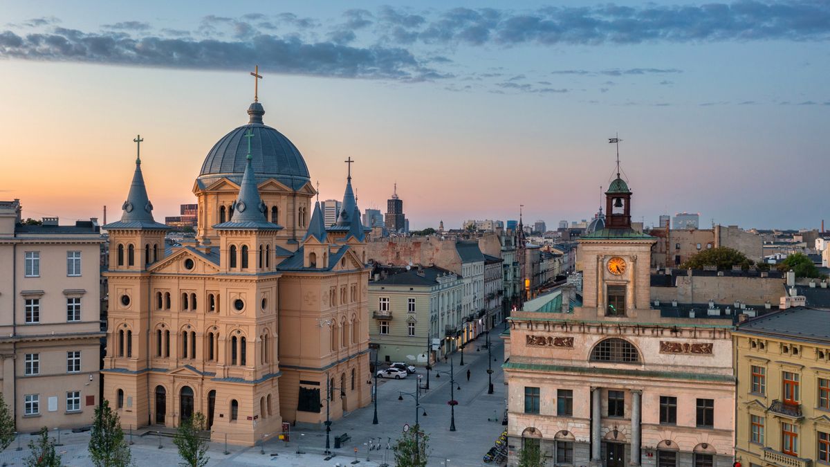 Beautiful scenery of Lodz city center with Piotrkowska street at dawn, Polandlodz, city, landmark, aerial, cityscape, view, travel, urban, architecture, street, skyline, tourism, drone, town, old, building, poland, landscape, piotrkowska, house, europe, sky, polish, sunset, church, horizon, historic, place, freedom, central, summer, scenery, cupola, dome, sunrise, dawn, square, dusk, center, roof, light, downtown, european, district, street light, from above, illuminated