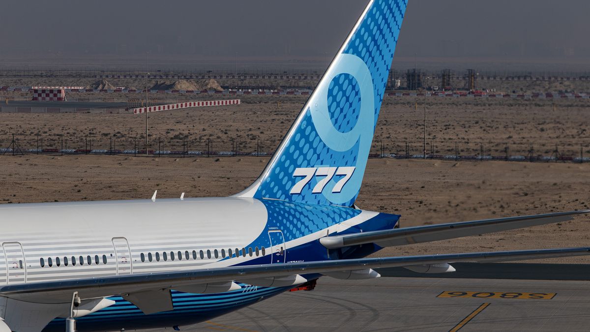 The tail of an experimental Boeing 777X aircraft at the Dubai Air Show in Dubai, United Arab Emirates, on Monday, Nov. 17, 2025. The airshow runs from Nov. 17-21, with expanded space and advanced air mobility pavilions this year. Photographer: Christopher Pike/Bloomberg via Getty Images