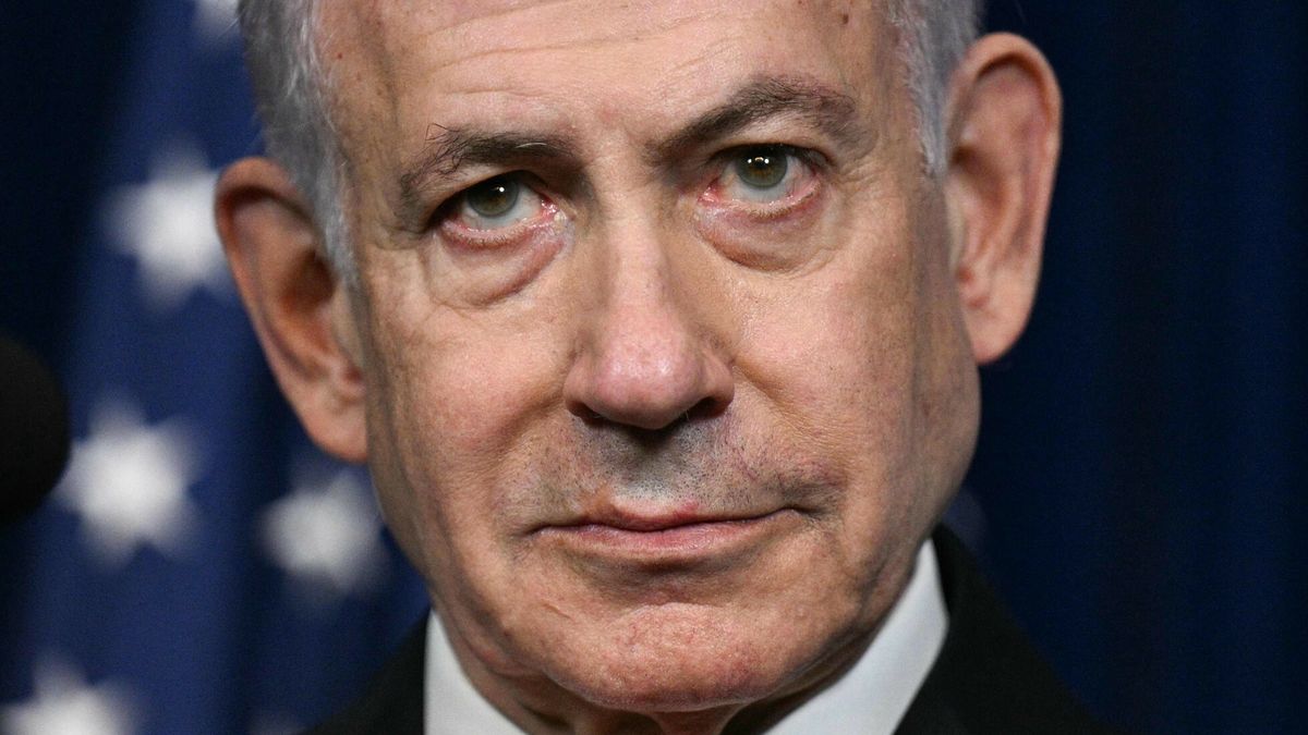 TemporaryIsraeli Prime Minister Benjamin Netanyahu looks on as US President Donald Trump (off frame) speaks during a joint press conference at Trump?s Mar-a-Lago residence in Palm Beach, Florida, on December 29, 2025. US President Donald Trump hosted Israeli Prime Minister Benjamin Netanyahu in Florida on December 29 for crucial talks on moving to the next stage of the fragile Gaza truce plan.The two leaders also discussed Iran, with Trump saying that if Tehran rebuilt its nuclear facilities the United States would "knock them down." (Photo by Jim WATSON / AFP)JIM WATSON