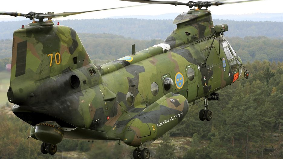 Gothenburg, Sweden - A Boeing Vertol CH-46 Sea Knight helicopter of the Swedish Air Force.
Daniel Karlsson/Stocktrek Images
air force, airborne, aircraft, boeing vertol, camouflage, ch-46, ch-46 sea knight, color image, day, flight, flying, foreign military, gothenburg, helicopter, horizontal, landing gear, livery, military, motion, no people, on the move, outdoors, paint scheme, photography, rotary wing aircraft, rotor blades, rotorcraft, scenic, side view, single object, sweden, swedish air force, swedish armed forces, tandem rotors, transportation, trees, woods