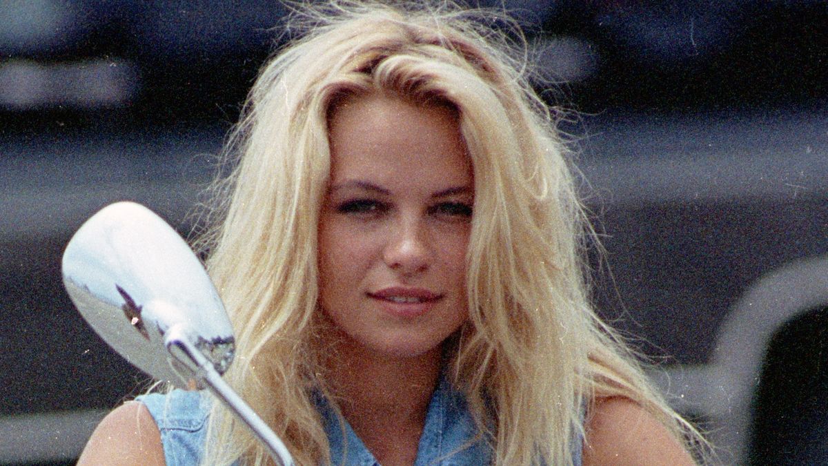 Pamela AndersonAmerican actress Pamela Anderson on a motorcycle in denim, circa 1990. (Photo by Kypros/Getty Images)Kyproshuty25743, 1990s