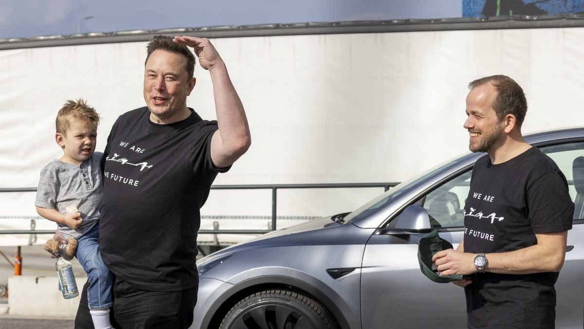 GRUENHEIDE, GERMANY - MARCH 13: CEO of Tesla Elon Musk with his son X Æ A-XII and Andre Thierig (R), plant manager of the Tesla Gigafactory, chat as they leave the Gigafactory following a visit on March 13, 2024 near Gruenheide, Germany. Musk is visiting the plant following an arson attack on March 4 on a nearby power transmission tower that left the factory without electricity until March 11. A leftist activists group called "Vulkan Group" ("Vulkangruppe") has taken responsibility for the attack. (Photo by Maja Hitij/Getty Images)