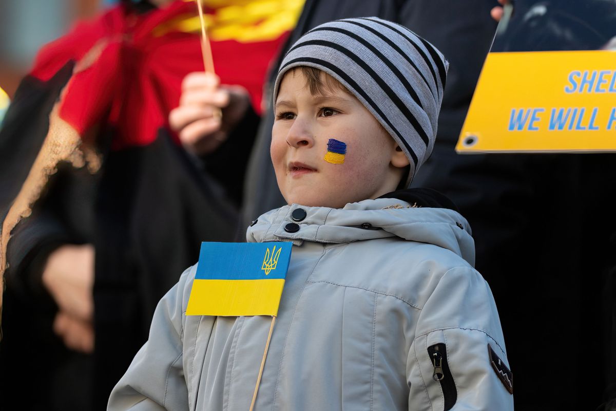 MANCHESTER, UNITED KINGDOM - 2022/03/05: Young boy holds up the Ukraine flag during the demonstration.
Thousands show up in Manchester Piccadilly Gardens to show support and solidarity for those suffering in Ukraine. Schoolchildren held up banners and had their faces painted while others spoke on the steps of the Queen Victoria Statue. (Photo by Jake Lindley/SOPA Images/LightRocket via Getty Images)