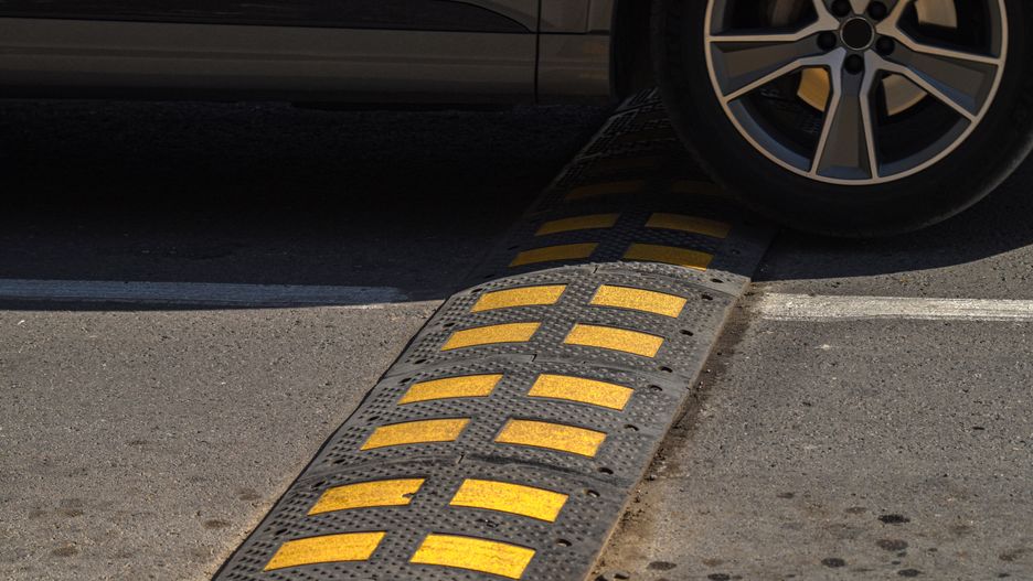 speed bump, road safety, traffic calming, urban safety, vehicle control, driving regulation, road hump, asphalt safety, traffic infrastructure, car safety, pedestrian zone, vehicle slow down, road equipment, highway safety, transport rules, urban infrastructure, safety hump, driving law, car speed control, safety measure, road design, speed control bump, asphalt regulation, traffic system, city safety, road hump yellow, vehicle restriction, slow driving element, pedestrian protection, traffic regulation, asphalt bump, driver safety, traffic slowing device, road maintenance, safety infrastructure, vehicle restriction bump, public road safety, driver control, urban law, highway regulation