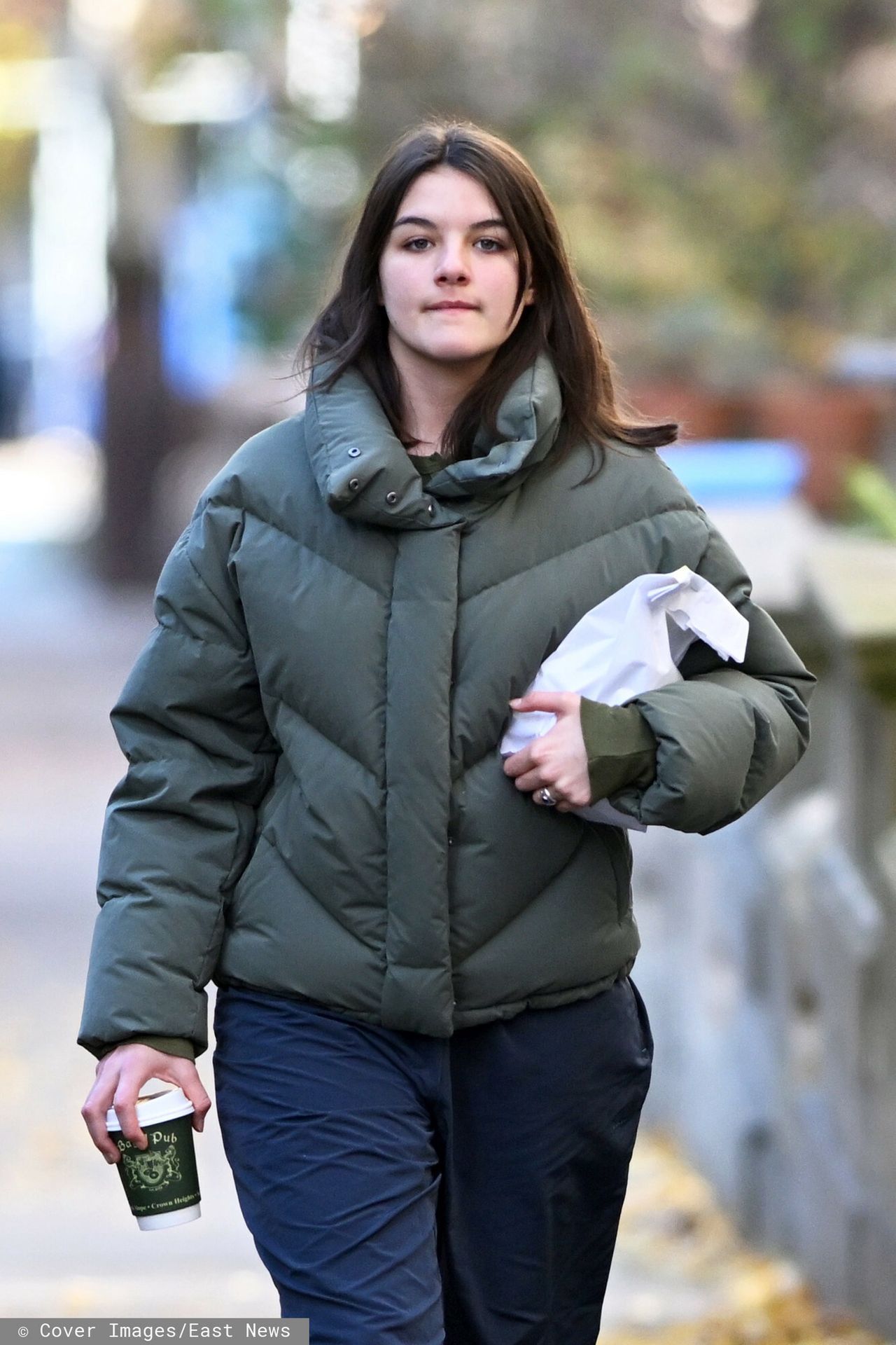 Suri Cruise speeds down a street in New York.