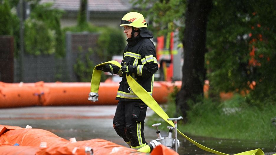 Temporary
A firefighter works on a flood protection at a flooded street in the small Bavarian village of Eichenau, southern Germany, on June 1, 2024. After heavy rainfall in the last days floods are expected in southern Germany. (Photo by Michaela STACHE / AFP)
MICHAELA STACHE