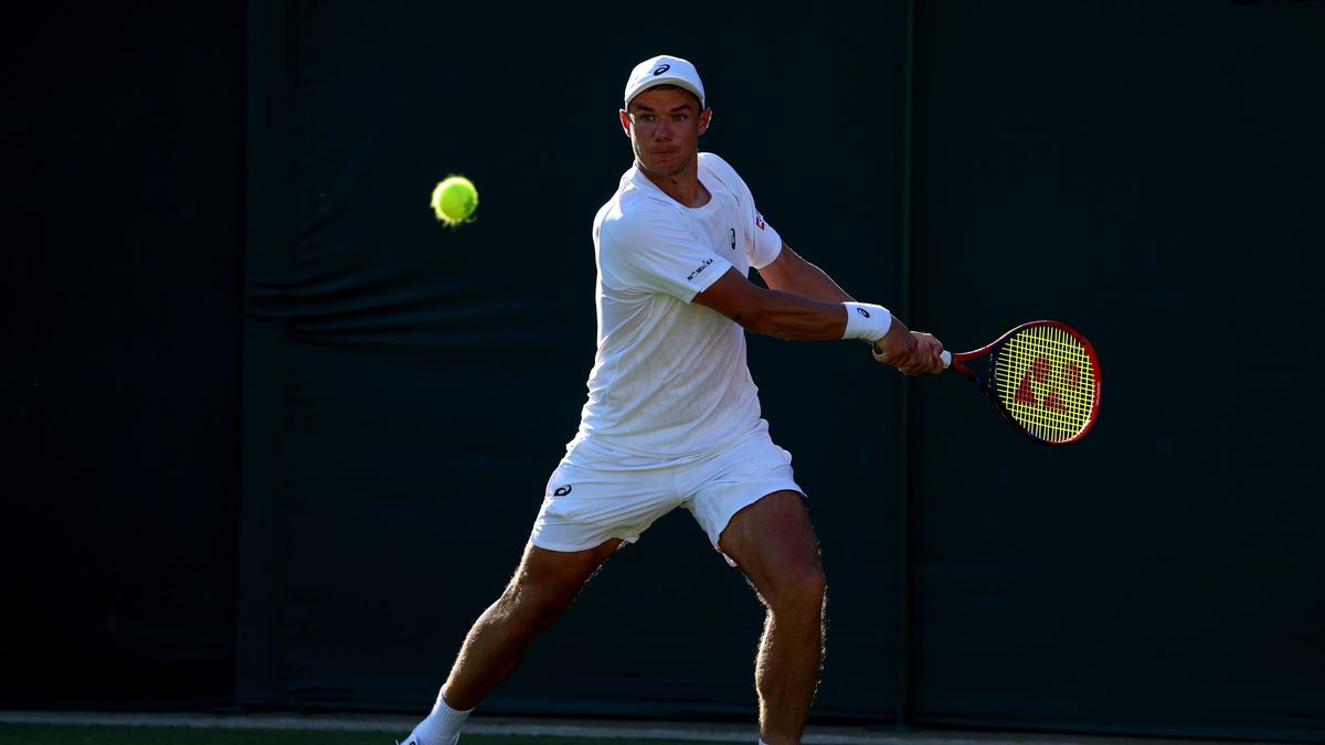 LONDON, ENGLAND - JUNE 30: Kamil Majchrzak of Poland plays a backhand against Matteo Berrettini of Italy during the Gentlemen's Singles first round match on day one of The Championships Wimbledon 2025 at All England Lawn Tennis and Croquet Club on June 30, 2025 in London, England. (Photo by Dan Istitene/Getty Images)