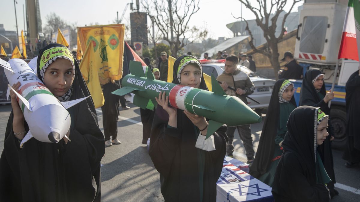 TEHRAN, IRAN - JANUARY 10: Girls from Iran's Basij march with fake coffins and rockets during a military parade on January 10, 2025 in Tehran, Iran. The Islamic Revolutionary Guard Corps and the Basij, a paramilitary group that has played a prominent role in suppressing protests, held military exercises in the Iranian capital. (Photo by Majid Saeedi/Getty Images)