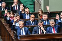 WARSAW, POLAND - APRIL 12: Polish Prime Minister, Donald Tusk (front, L) and some members of his cabinet raise their hands during the voting on four draft projects on abortion rights at the Polish Parliament( SEJM) on April 12, 2024 in Warsaw, Poland. The center-right government led by Donald Tusk has proposed ending the country's near-total ban on abortion to allow for the procedure up to the 12th week of pregnancy. Lawmakers are also considering alternative, less far-reaching bills proposed by other parties in the governing coalition, which is divided on the issue of abortion rights. (Photo by Omar Marques/Getty Images)