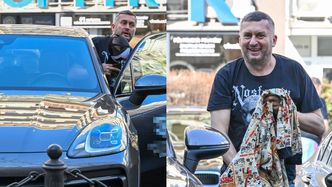 Norbi śle fotoreporterom uśmiechy i pozuje przy porsche wartym prawie 400 tysięcy złotych