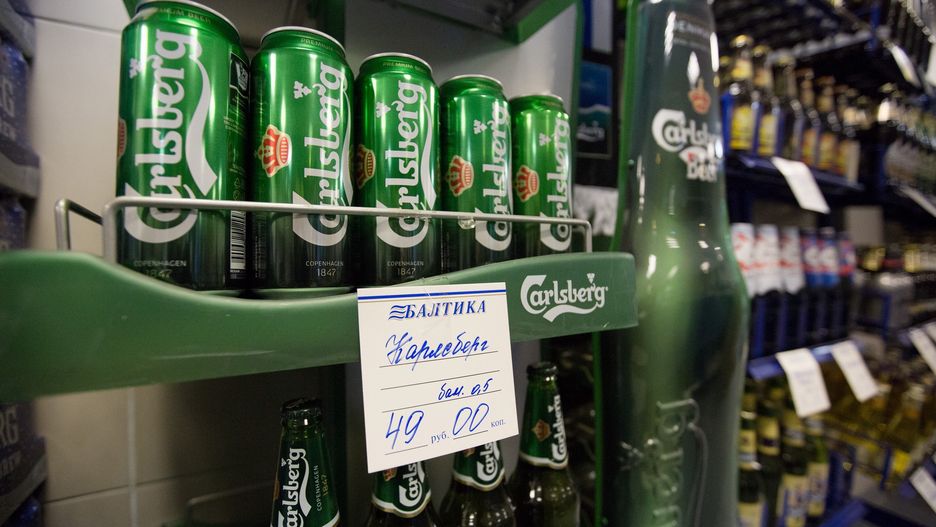 Inside Russia's Biggest Beer Maker OAO Baltika Operated By Carlsberg A/SA hand written ruble price label sits beneath a display of Carlsberg beer for sale in the factory store at the OAO Baltika brewery, operated by Carlsberg A/S, in Saint Petersburg, Russia, on Wednesday, Dec. 17, 2014. Shares in the Danish company, which is the biggest beer maker in Russia, had plunged 15 percent this month through yesterday, giving it a market capitalization of 70 billion kroner ($12 billion). Photographer: Andrey Rudakov/Bloomberg via Getty ImagesBloombergEAME; EUROPE; RUSSIA; USSR, ECONOMIC CRISIS; RECESSION, ECONOMY; ECONOMIC; ECO, ECONOMY; ECONOMIC; SPENDING, EMEA; EASTERN EUROPE, EMEA; EUROPE, FINANCE; FINANCIAL; ECONOMY