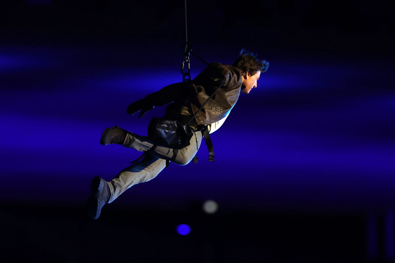 Closing Ceremony - Olympic Games Paris 2024: Day 16
PARIS, FRANCE - AUGUST 11: 
American Actor and Film Producer Tom Cruise rappels from the roof of the Stadium during the Closing Ceremony of the Olympic Games Paris 2024 at Stade de France on August 11, 2024 in Paris, France. (Photo by Steph Chambers/Getty Images)
Steph Chambers