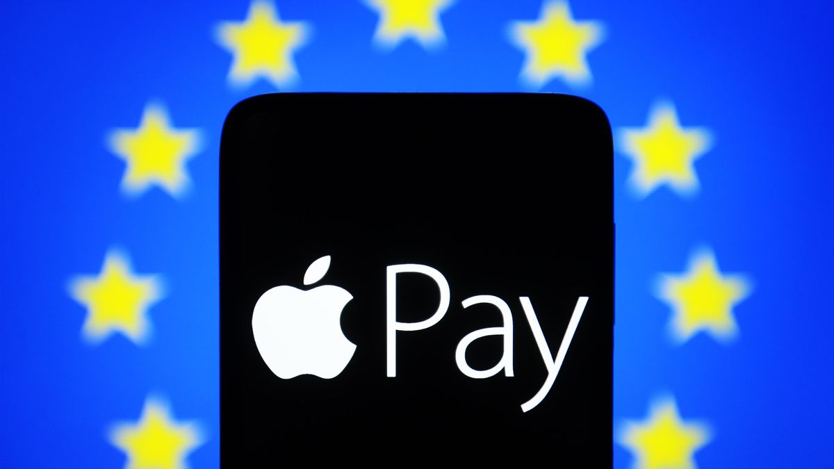 UKRAINE - 2023/05/13: In this photo illustration, an Apple Pay logo is seen on a smartphone and European Union (EU) flag on a pc screen. (Photo Illustration by Pavlo Gonchar/SOPA Images/LightRocket via Getty Images)