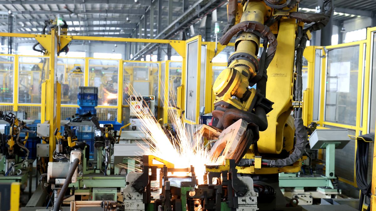 NINGDE, CHINA - OCTOBER 17: A robot works on the production line of auto parts at the workshop of Ningde Zhenhua Zhende Automotive Parts Co., Ltd. on October 17, 2024 in Ningde, Fujian Province of China. (Photo by Wang Wangwang/VCG via Getty Images)