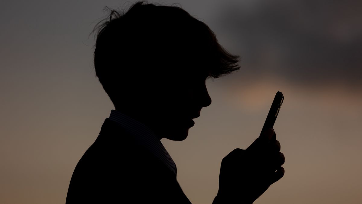 BATH, UNITED KINGDOM - MAY 21: In this photo illustration a 13-year-old boy looks at a iPhone screen display on May 21, 2025 in Bath, England. Recently the Australian Senate passed a law to ban children under 16 from having social media accounts and social media platforms, including TikTok, Facebook, Snapchat, Reddit, X, formerly Twitter, and Instagram potentially being be fined for preventing children younger than 16 from having social media accounts. (Photo by Anna Barclay/Getty Images)