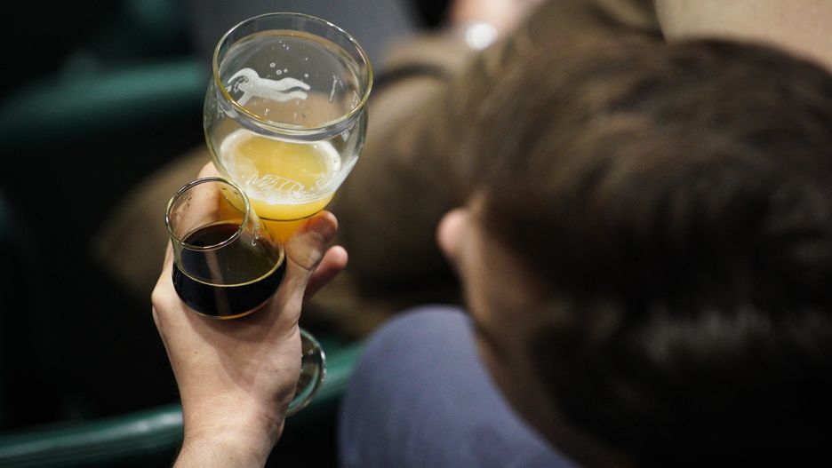 A man holds two beers during the Warsaw Beer Festival in Warsaw, Poland on 25 October, 2019. The 11th Warsaw Beer Festival is presenting visitors with over 800 beers on tap and more than a hundred premiers of brews not available in shops. Poland has since a couple of years seen a large increase in locally and specialty brewed beers. (Photo by Jaap Arriens/NurPhoto via Getty Images)