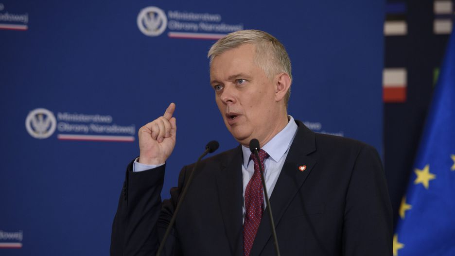 Minister of Interior Tomasz Siemoniak is gesturing as he is speaking during a press conference at the Ministry of Defence in Warsaw, Poland, on July 17, 2024. Deputy Prime Minister and Defence Minister Wladyslaw Kosiniak-Kamysz, together with Minister of Interior Tomasz Siemoniak, Secretary of State and Deputy Minister Cezary Tomczyk, and Deputy Minister at the Ministry of Interior and Administration Czeslaw Mroczek, are holding a press conference about the situation at the eastern Polish-Belarussian border amidst the ongoing weaponisation of the migratory crisis by the Belarusian government. They are discussing the strengthening and development of defence infrastructure and further support of the Territorial Defence troops, Police, and Border guards in terms of equipment and more authority towards aggressive behaviour. (Photo by Aleksander Kalka/NurPhoto via Getty Images)