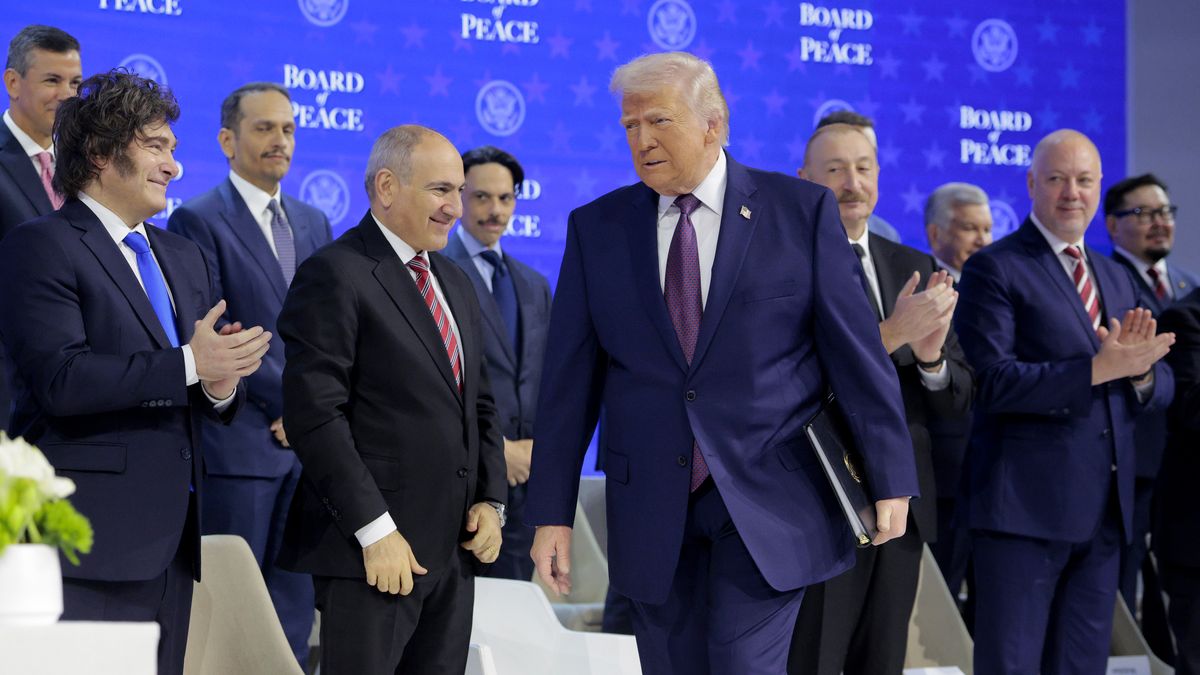 DAVOS, SWITZERLAND - JANUARY 22: U.S. President Donald Trump arrives onstage to present the “Board of Peace” at the World Economic Forum (WEF) on January 22, 2026 in Davos, Switzerland. The annual meeting of political and business leaders comes amid rising tensions between the United States and Europe over a range of issues, including Trump's vow to acquire Greenland, a semi-autonomous Danish territory. (Photo by Chip Somodevilla/Getty Images)