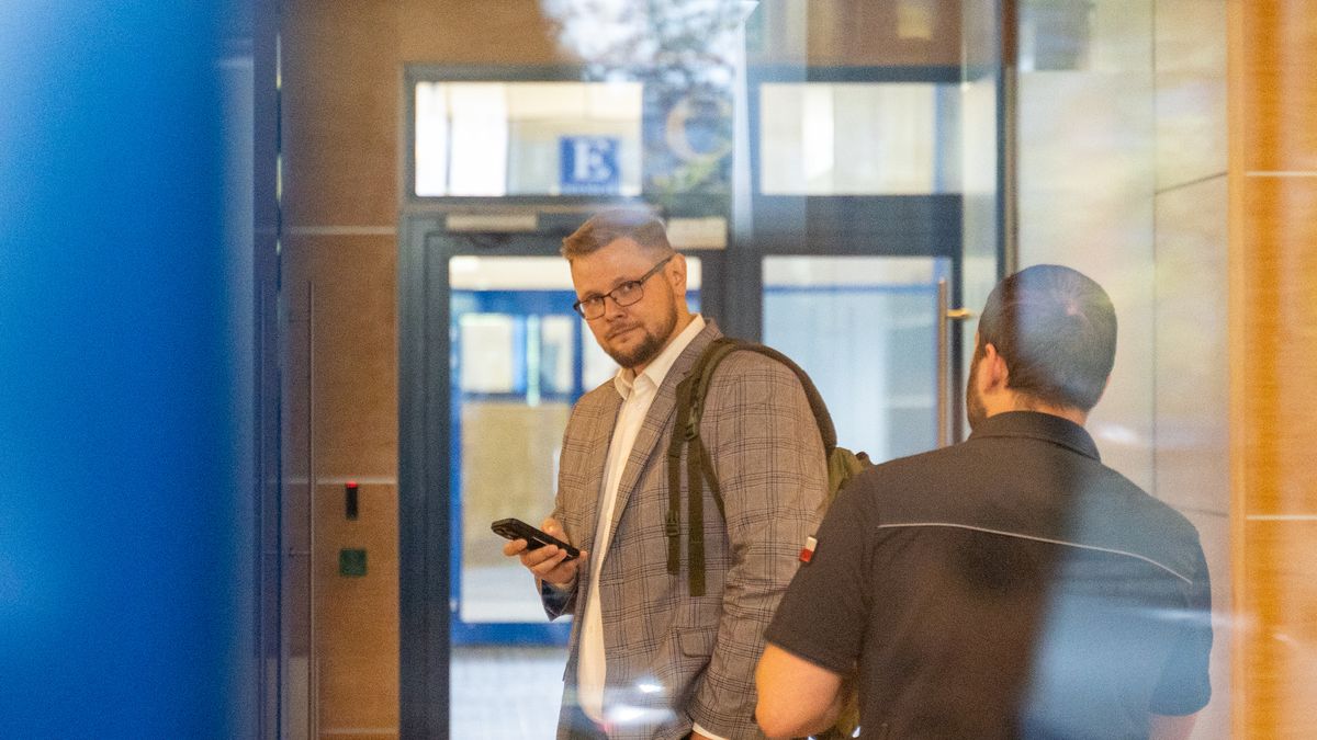 WARSAW, POLAND - 2024/08/27: MP Michal Wos looks into the camera as he enters the National Prosecutor's Office for questioning, where he is expected to face charges. Politician MP Michal Wos appeared at the National Prosecutor's Office in connection with an ongoing investigation into the Justice Fund. The prosecution intends to present charges against him, as a suspect. The case points on alleged irregularities in the distribution of Justice Fund resources, with particular focus on Wos's decision to allocate 6,507,125.00 United States Dollar for the purchase of the controversial Pegasus surveillance system. Prior to the hearing, at 10:45 AM, Wos held a press conference in front of the National Prosecutor's Office building, addressing the media about the allegations and the broader investigation. (Photo by Marek Antoni Iwanczuk/SOPA Images/LightRocket via Getty Images)