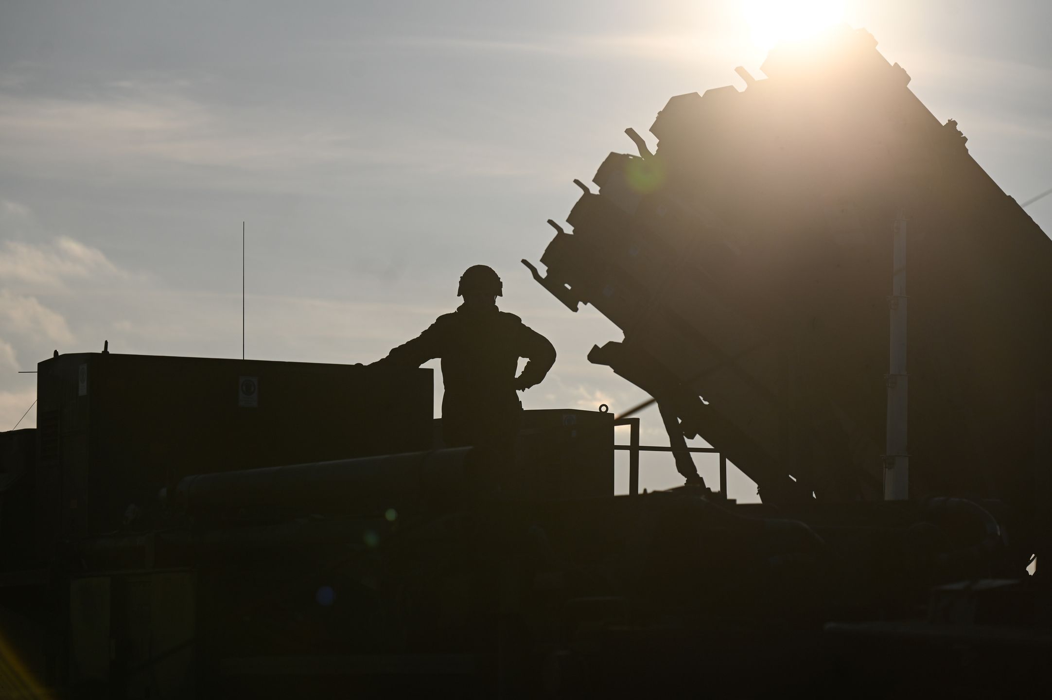 JASIONKA, POLAND - JANUARY 23: A german soldier stands on the top of a truck as he and others unload the US made MIM-104 Patriot surface-to-air missile (SAM) system on January 23, 2025 in Jasionka, Poland. Germany recently redeployed a Patriot air defense system in Poland, its NATO ally. (Photo by Omar Marques/Getty Images)