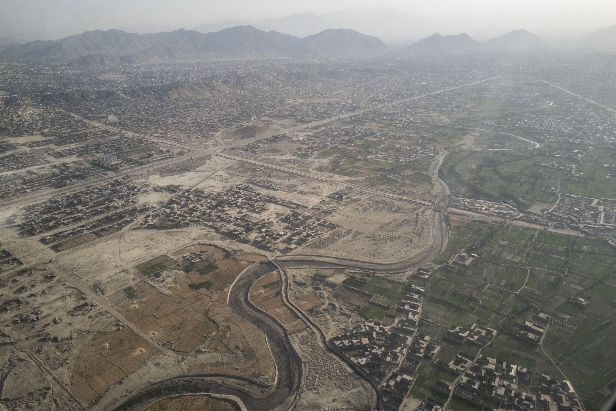 KABUL, AFGHANISTAN - JUNE 24:Kabul, Afghanistan as seen from a plane on June 24, 2025. Until recently, U.S. aid accounted for more than 40 percent of humanitarian support to Afghanistan for basic necessities like food and health care, especially in rural areas. President Donald Trump's cuts to U.S. foreign aid are the most significant in American history.(Photo by Carolyn Van Houten/The Washington Post via Getty Images)