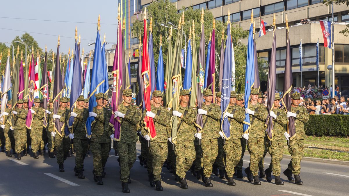 Military festive parade of the Croatian armyZagreb, Croatia - August 04, 2015: Military festive parade of the Croatian army on the anniversary of the liberation action Storm in downtown Zagreb.ivansmukZagreb, Obedience, Parade, Celebration, Anniversary, Camouflage Clothing, Memorial, Gun, Promenade, Protest, Camouflage, Marching, Military, Order, In A Row, Cultures, Arrangement, Travel Destinations, Outdoors, Crowd, Security Guard, Army, Armed Forces, Professional Occupation, Veteran, People, Croatia, Weapon, Ceremony, Uniform, soldiery, Victory