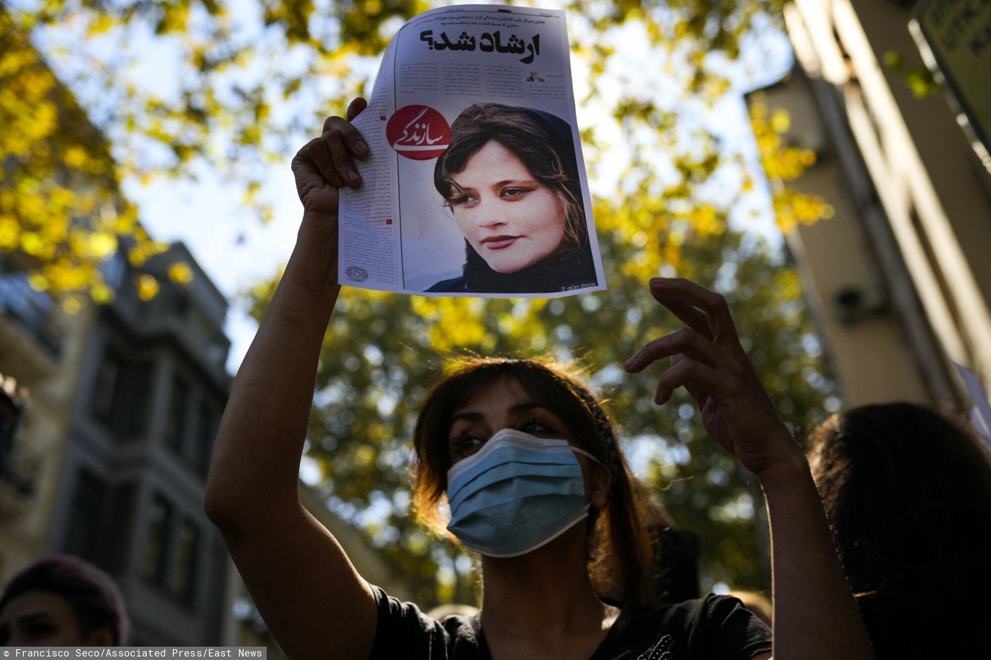 TemporaryA woman holds up a copy of a newspaper article with the photo of Iranian Mahsa Amini that reads in Persian: "It was Ershad?" during a protest against the death of Amini, outside Iran's general consulate in Istanbul, Turkey, Wednesday, Sept. 21, 2022. Iran's morality police is know as "Gashte Ershad" or guidance patrols. Protests have erupted across Iran in recent days after Mahsa Amini, a 22-year-old woman, died while being held by the morality police for violating the country's strictly enforced Islamic dress code. (AP Photo/Francisco Seco)Francisco Seco