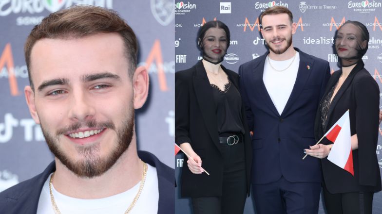 Krystian Ochman pozuje na turkusowym dywanie przed Eurowizją w Turynie