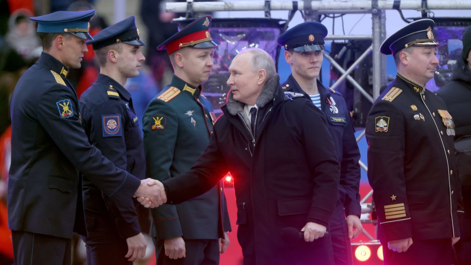 MOSCOW, RUSSIA - FEBRUARY 22:  (RUSSIA OUT) Russian President Vladimir Putin greets members of the military during a concert in Luzhniki Stadium on February 22, 2023 in Moscow, Russia. Thousands of people gathered at the Moscow stadium for a pro-Putin rally marking 'Defender of the Fatherland Day' as well as the first anniversary of Russia's military invasion of Ukraine. (Photo by Contributor/Getty Images)