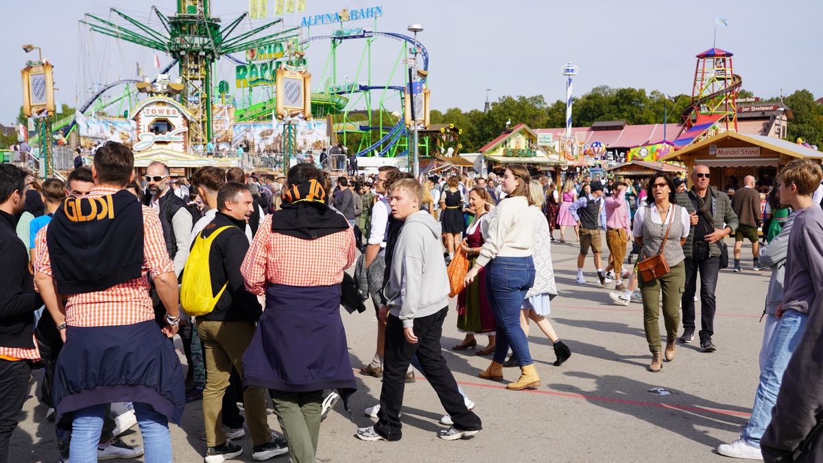 Locals and tourists spend their time at the Oktoberfest in Munich, Germany, on September 23, 2022. (Photo by Michael Nguyen/NurPhoto via Getty Images)