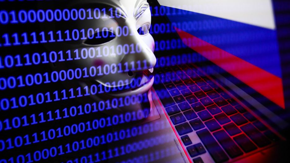 Russian flag displayed on a laptop screen, Guy Fawkes mask and binary code displayed on a screen are seen in this multiple exposure illustration photo taken in Krakow, Poland on March 1, 2022. Global hacker group Anonymous declared 'cyber war' against Russia. (Photo by Jakub Porzycki/NurPhoto via Getty Images)