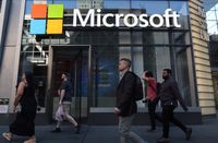 NEW YORK, NY - JUNE 24: People walk past the front entrance to a Microsoft office building on 8th Avenue on June 24, 2025, in New York City. (Photo by Gary Hershorn/Getty Images)