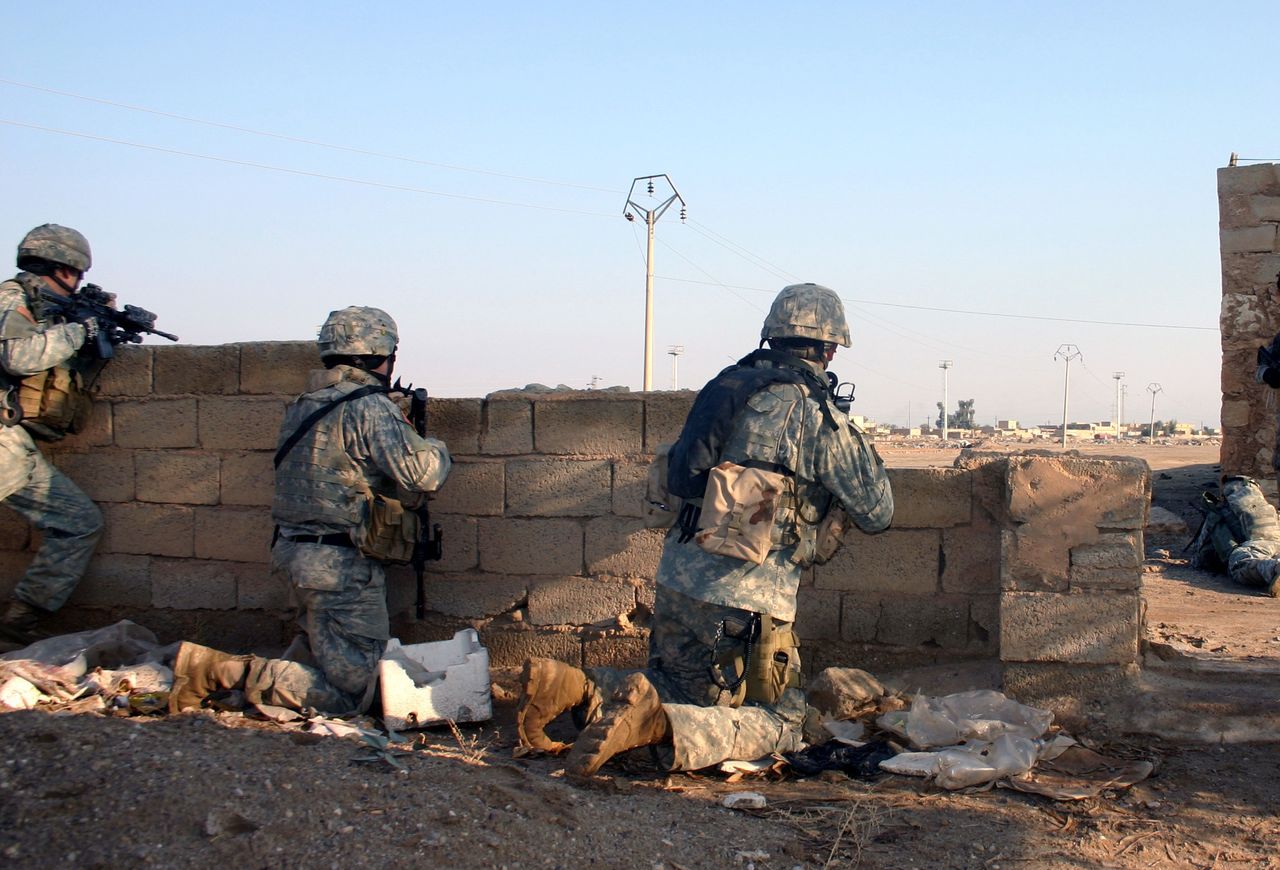 A Group of U.S. Soldier look for an enemy that fired on their position.