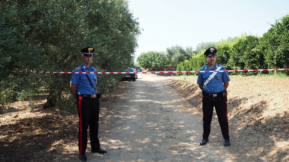 APOLLINARA, CORIGLIANO ROSSANO, CALABRIA, ITALY - 2019/07/23: The Carabinieri on the site of the mafia ambush in Calabria where two men were shot to death. The victims are a special security guard, for crimes of 'Ndrangheta Pietro Greco, 39, of Castrovillari, and an businessman, Francesco Romano, 44 years old of Corigliano Rossano. The victims were found inside a car in a rural area of the Apollinara hamlet and were hit by numerous gunshots, a Kalashnikov and a gun. (Photo by Alfonso Di Vincenzo/KONTROLAB/LightRocket via Getty Images)