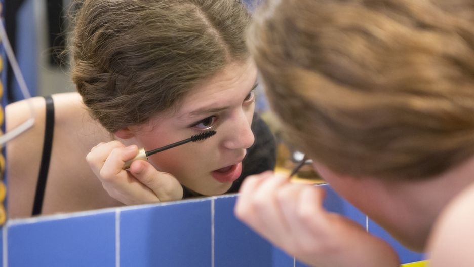 Teenage girl putting on makeup
Owen Franken
null