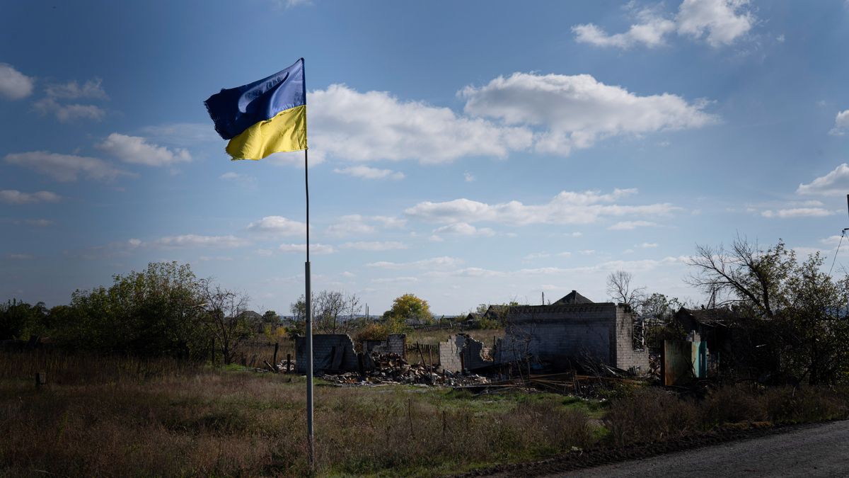 LYMAN, DONETSK REGION, UKRAINE - 2022/10/08: A Ukrainian flag is waving near Yampil, a settlement and railroad station in Lyman in the Donetsk region. The fight between Ukraine and Russia intensifies as Ukrainian troops continue their advancement near the border of Luhansk, Donetsk, and Kharkiv region. Many settlements have become abandoned after residents escaped due to the fight. The liberation of Lyman and Zelena Dolyna, strategic cities in the Donetsk region, was a symbolic victory for Ukraine. (Photo by Ashley Chan/SOPA Images/LightRocket via Getty Images)