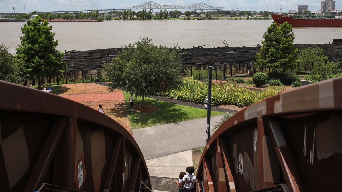 NEW ORLEANS, LOUISIANA, UNITED STATES - 2025/07/12: Crescent Park, a park in the Bywater neighborhood of New Orleans, Louisiana, overlooking the Mississippi River, is pictured from a pedestrian bridge. The Bywater is a neighborhood which began undergoing gentrification after Katrina. On August 29, 2005, Katrina struck the Gulf of Mexico, devastating the city of New Orleans in the United States. Twenty years later, although physical reconstruction has taken place, its residents still suffer from psychological disorders such as anxiety, depression, and post-traumatic stress. (Photo by Apolline Guillerot-Malick/SOPA Images/LightRocket via Getty Images)