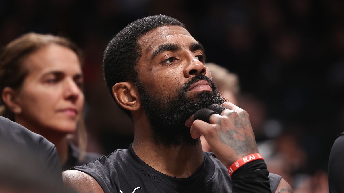 NEW YORK, NEW YORK - OCTOBER 31: Kyrie Irving #11 of the Brooklyn Nets looks on from the bench during the third quarter of the game against the Indiana Pacers at Barclays Center on October 31, 2022 in New York City. NOTE TO USER: User expressly acknowledges and agrees that, by downloading and or using this photograph, User is consenting to the terms and conditions of the Getty Images License Agreement. (Photo by Dustin Satloff/Getty Images)