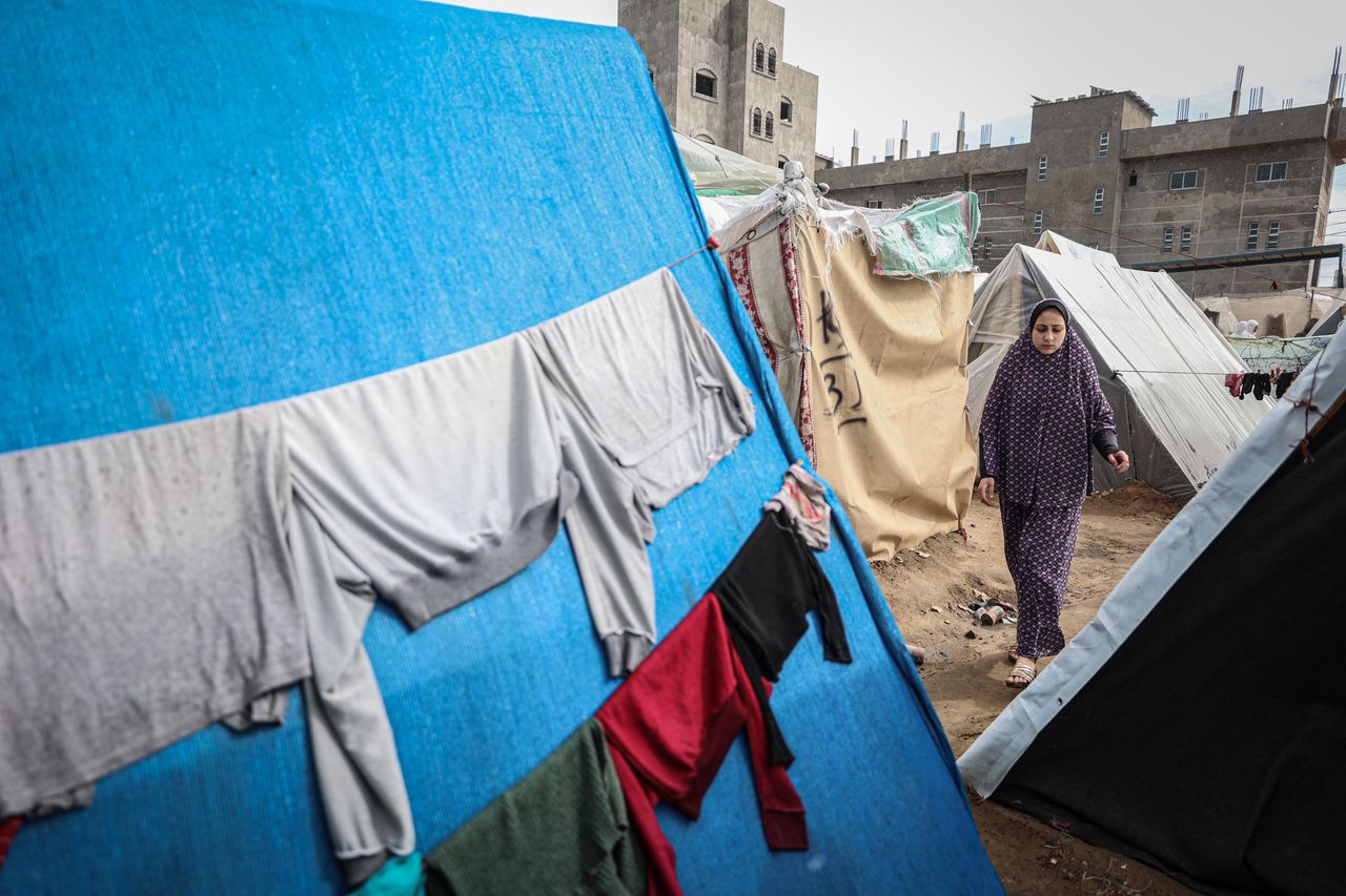 Displaced Palestinians inside shelter camps in the Rafah camp in the southern Gaza Strip suffer due to rainfall and cold weather, Feb 2, 2024. (Photo by Loay Ayyoub/For The Washington Post via Getty Images)