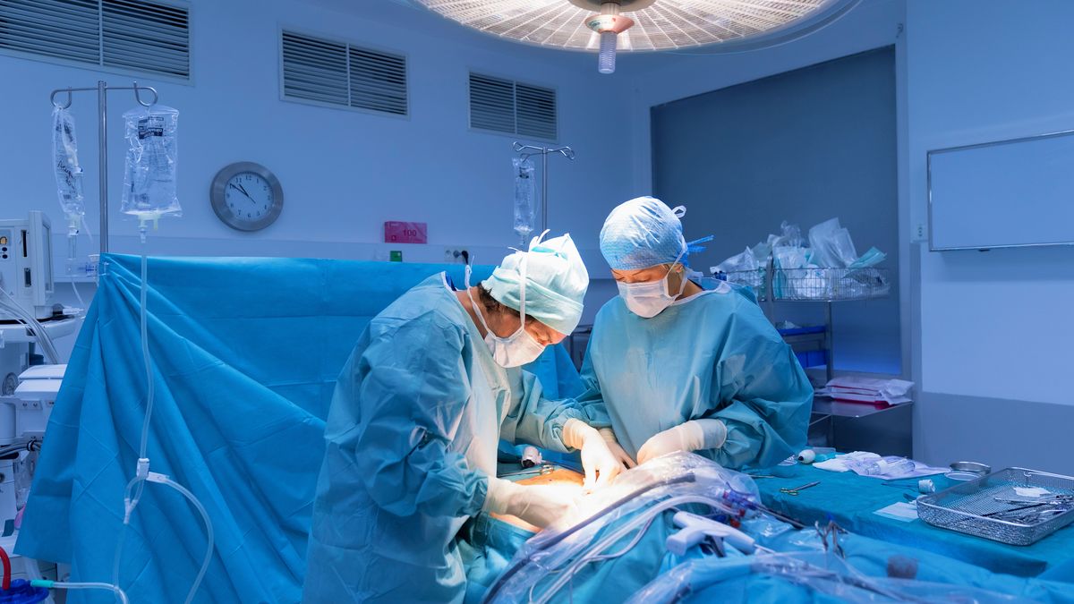 Surgeons performing surgery in operating Theater.