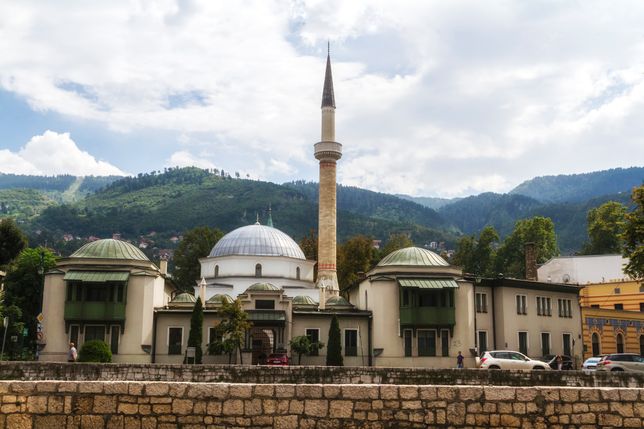 SARAJEVO / BOSNIA AND HERZEGOVINA - September 2, 2018: Outdoor view of Careva Dzamija mosque in Sarajevo on the miljacka riverbank. 