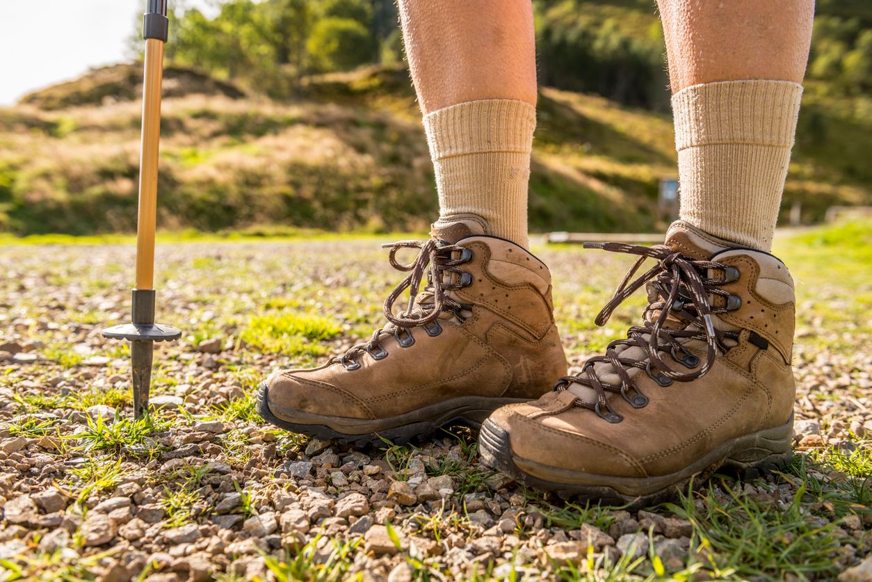 Close up of a pair of Hiking Boots on a gravel path. 